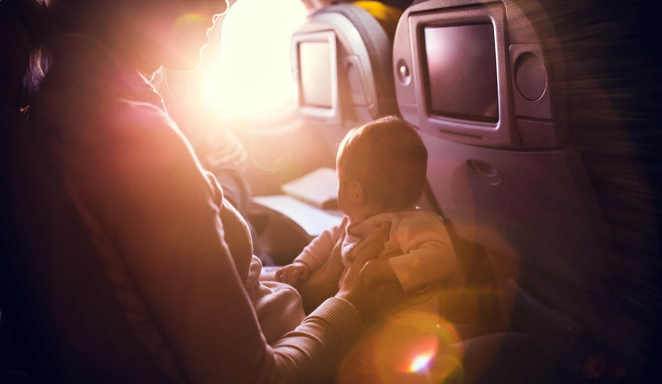 Image of a female passenger holding an infant