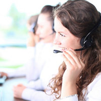 Image of three people talking on the phone with headphones